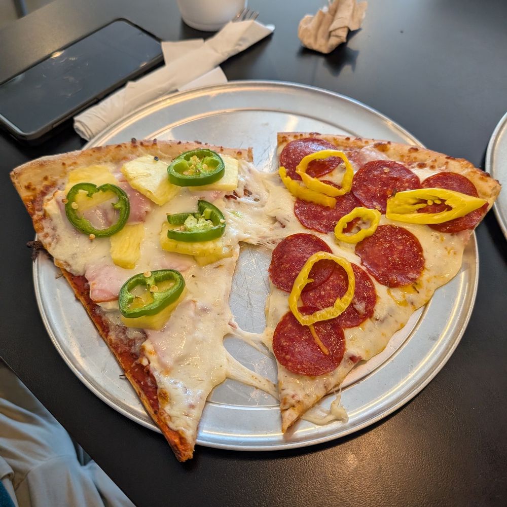A lonely pizza box on a dark street