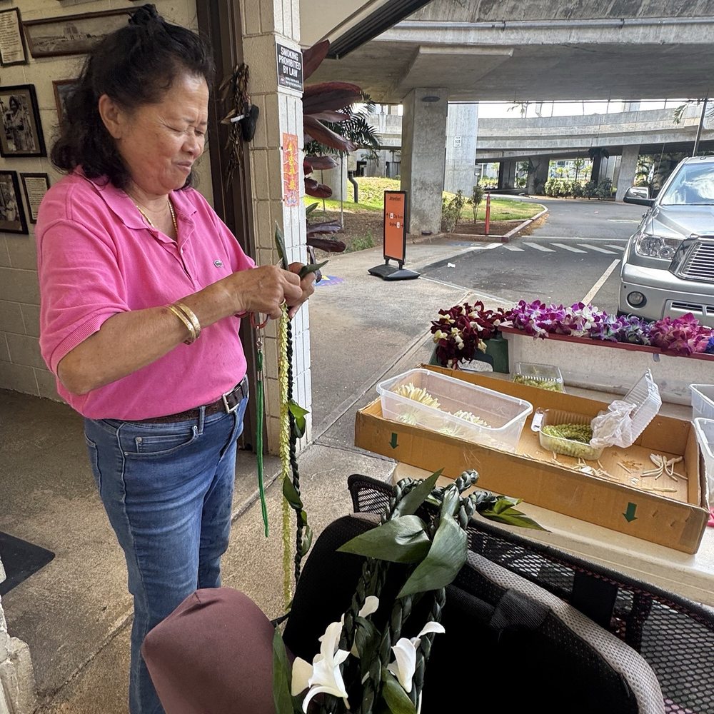 Harriet's Lei Stand - Chose a ti leaf intertwined with pakalana for the graduate. - Gift Shops Near Me - Honolulu, Hawaii Harriet's Lei Stand - Chose a ti leaf intertwined with pakalana for the graduate. - Gift Shops Near Me - Honolulu, Hawaii