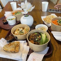 Bottom - scallion pancakes, vegetable dumplings, chicken dumplings, shiitake chicken noodles. Bottom - scallion pancakes, vegetable dumplings, chicken dumplings, shiitake chicken noodles.
