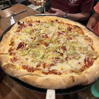 Sergio's - Sun dried tomato and artichoke pizza with vegan cheese - Pizza Near Me - Midlothian, Virginia Sergio's - Sun dried tomato and artichoke pizza with vegan cheese - Pizza Near Me - Midlothian, Virginia