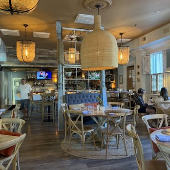 Community Table - people sitting at tables in a restaurant - Comfort Food Near Me - Mt Pleasant, South Carolina