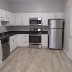 Stonebay Senior Living - Our beautiful kitchens featuring stainless steal appliances with black granite counter tops and smart soft closing cabinets and drawers.