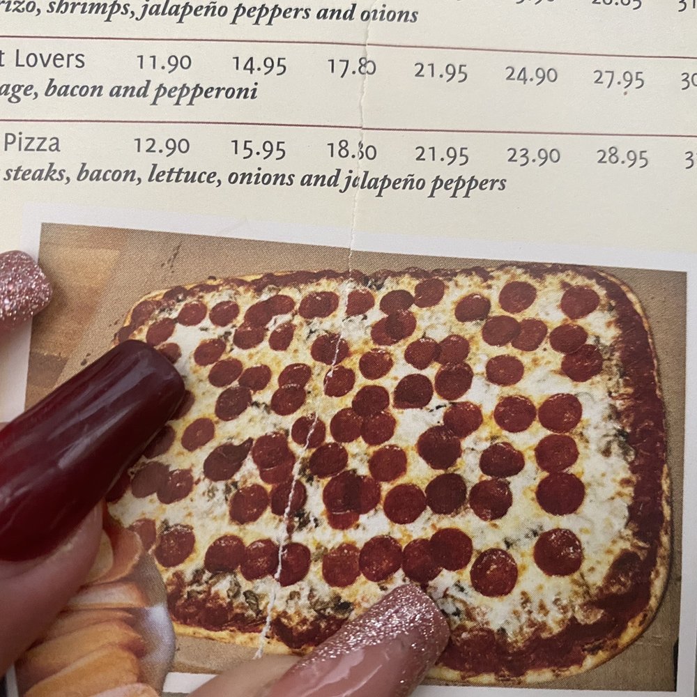 Durango's Pizza - a hand holding a pepperoni pizza - Pizza Near Me - Chicago, Illinois Durango's Pizza - a hand holding a pepperoni pizza - Pizza Near Me - Chicago, Illinois