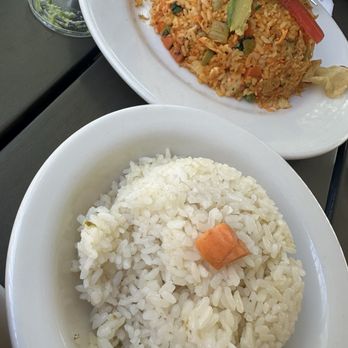 Republica Empanada - Side of white rice and the arroz con pollo in the back.. - Latin American Near Me - Mesa, Arizona Republica Empanada - Side of white rice and the arroz con pollo in the back.. - Latin American Near Me - Mesa, Arizona