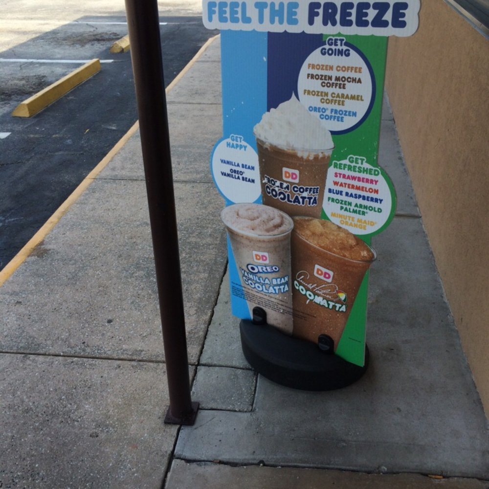 Dunkin' -  a sign on the side of a sidewalk - Coffee & Tea Near Me - St Augustine, Florida