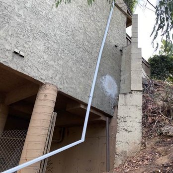 Gutter Guru - Downspout extension to lower level. - Gutter Services Near Me - Carlsbad, California Gutter Guru - Downspout extension to lower level. - Gutter Services Near Me - Carlsbad, California