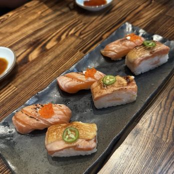 Temaki Den - Salmon Belly w/ creme fraiche and smoked trout roe Salmon Belly Aburi Nigiri - Sushi Bars Near Me - Denver, Colorado