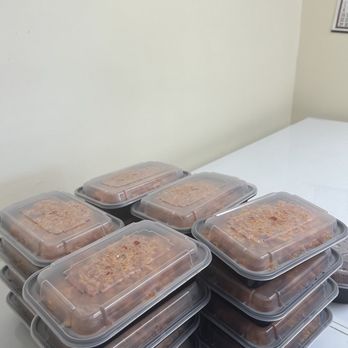 Ewe's Delicious Treats - a stack of plastic containers - African Near Me - Brooklyn, New York Ewe's Delicious Treats - a stack of plastic containers - African Near Me - Brooklyn, New York