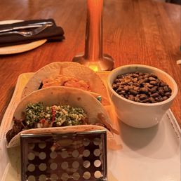 Carne Asada and 8 Hour Brisket Tacos with side of Black Beans and white rice Carne Asada and 8 Hour Brisket Tacos with side of Black Beans and white rice