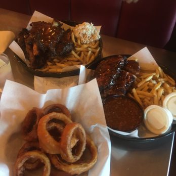Phil's BBQ - Beefy Rib Dinner with 5 ribs (top left), baby back rib full rack dinner (right) and onion rings. All for $67 - Barbeque Near Me - San Diego, California Phil's BBQ - Beefy Rib Dinner with 5 ribs (top left), baby back rib full rack dinner (right) and onion rings. All for $67 - Barbeque Near Me - San Diego, California
