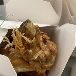 Chicken wing with hair still on it. Thought it was the chicken head Chicken wing with hair still on it. Thought it was the chicken head