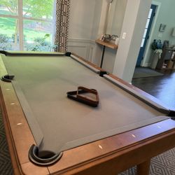 Carolina Pool Tables Plus - Pool table with grey felt top. Comes with balls, sticks, and rack
