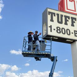 Energy Source Electric - Team installing signage safely on a lift delivering expert service with precision and professionalism.