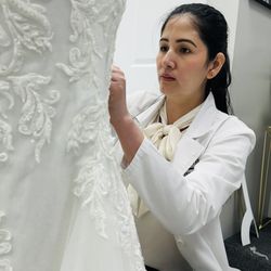 Tailors Couture - Working in Wedding Gown bustle .