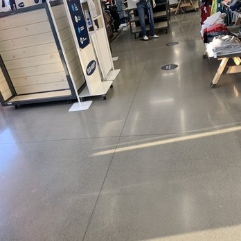 Old Navy - Clothing store interior with mannequins dressed in casual outfits, racks of folded and hanging clothes, and store signage. - Men's Clothing Near Me - Sterling, Virginia