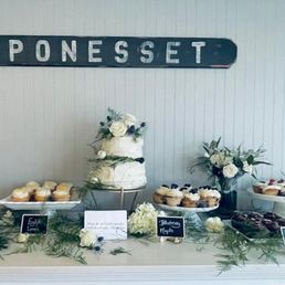 a table of cupcakes and desserts