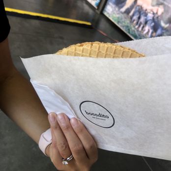 Bocadito - a person holding a waffle sandwich - Pop-Up Restaurants Near Me