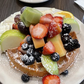 Ball Square Cafe - The Delight - Belgian waffle with fresh fruit, powdered sugar and homemade whipped cream - Breakfast & Brunch Near Me - Somerville, Massachusetts