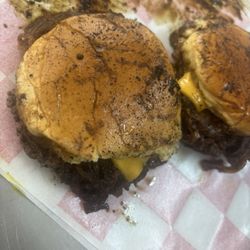 Sig's by the Beach - Our delicious slider smash burgers topped with freshly made caramelized onions, American cheese, pickles, mustard, and buttered buns