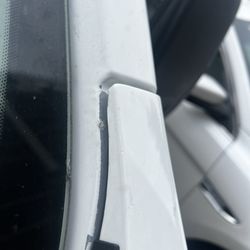 Classic Collision - Unpainted area under drivers side fender that was replaced .