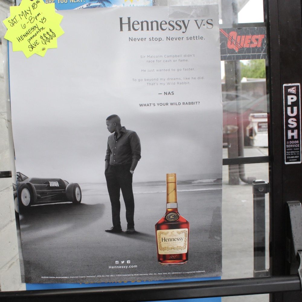 Madeira Discount Liquor - a man standing in front of a car - Beer, Wine & Spirits Near Me - Newark, California
