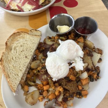 Jelly - Sweet potato hash with poached eggs; chilaquiles in the back - New American Near Me - Denver, Colorado Jelly - Sweet potato hash with poached eggs; chilaquiles in the back - New American Near Me - Denver, Colorado