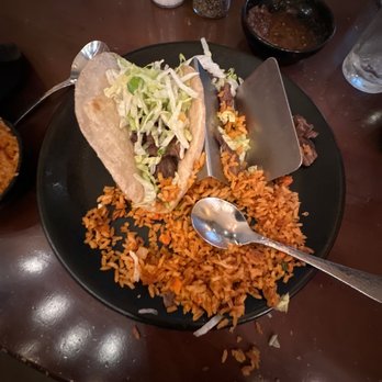 Uncle Julio's - 2 steak tacos with lettuce and rice - Tex-Mex Near Me - Schaumburg, Illinois Uncle Julio's - 2 steak tacos with lettuce and rice - Tex-Mex Near Me - Schaumburg, Illinois