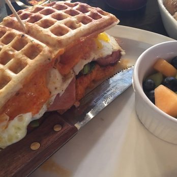 Toast - Ham,tomato,avocado,and pimento cheese waffle sandwich with a side of fruit. - Breakfast & Brunch Near Me - New Orleans, Louisiana Toast - Ham,tomato,avocado,and pimento cheese waffle sandwich with a side of fruit. - Breakfast & Brunch Near Me - New Orleans, Louisiana