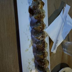 Rakuten Bar and Grill - It had Plantains on top, Churasco, spicy mayo, maybe eel sauce idk, and it was spicy.