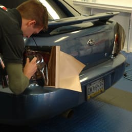 Tail light tinting being applied to a 2007 Subaru Impreza.