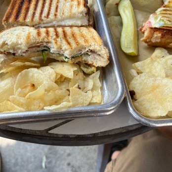 41 North Coffee - Turkey and artichoke and pesto panini off to the side - Coffee & Tea Near Me - Wendell, North Carolina