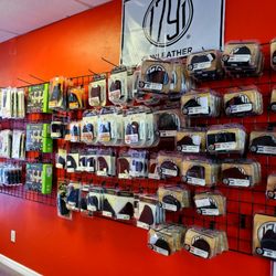 Naples Gun Shop & School - Plenty of holsters on hand.