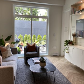 Mosaic Homes - a living room with a large window - General Contractors Near Me - Vancouver, British Columbia Mosaic Homes - a living room with a large window - General Contractors Near Me - Vancouver, British Columbia