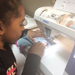 Zoelee's Fabrics & Sewing School - Ella one of our new preteens that is 8 years old. She is making a Flip Flop pillow. Learning to use a sewing machine.