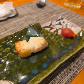 Sushi Suzuki - I broke it in half before remembering to take a photo. The person I was with said this was their favorite dish. - Sushi Bars Near Me - Seattle, Washington