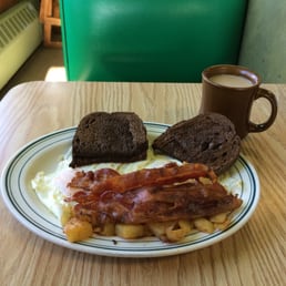 Three eggs over easy (I ordered two and they gave me three!) home fries, rye toast, bacon and a bottomless cup of coffee. Three eggs over easy (I ordered two and they gave me three!) home fries, rye toast, bacon and a bottomless cup of coffee.