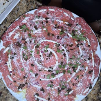 Firefly - Kobe Carpaccio
Micro greens, red onions, shaved parmesan, fried capers, horseradish cream, olive oil - Steakhouses Near Me - Panama City Beach, Florida Firefly - Kobe Carpaccio
Micro greens, red onions, shaved parmesan, fried capers, horseradish cream, olive oil - Steakhouses Near Me - Panama City Beach, Florida