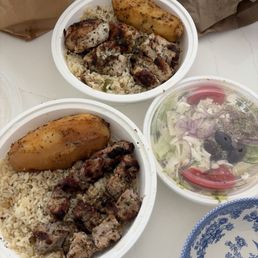 To go pork souvlaki and chicken brochette with one of two Greek salads that come with the meals. To go pork souvlaki and chicken brochette with one of two Greek salads that come with the meals.