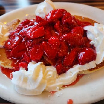 Tom's - Pasadena - Two pancakes with strawberries & whipped cream on top is amazing. - Burgers Near Me - Pasadena, California