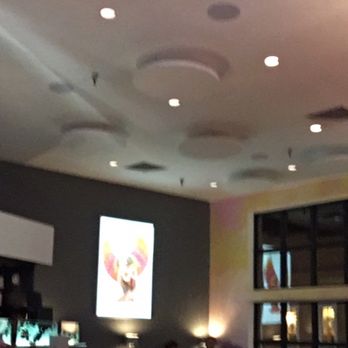 Coyote Cafe - Interior with chandelier and backlit art. Nice restaurant! - New American Near Me - Santa Fe, New Mexico Coyote Cafe - Interior with chandelier and backlit art. Nice restaurant! - New American Near Me - Santa Fe, New Mexico
