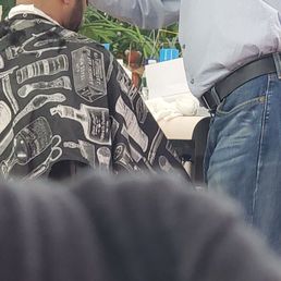 If you understand haircuts, he is done with the fade bc he is finalizing the haircut with scissors.