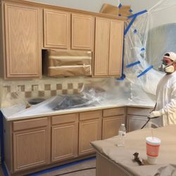 Genesis painting and remodelling - Prepping and painting kitchen cabinets.
