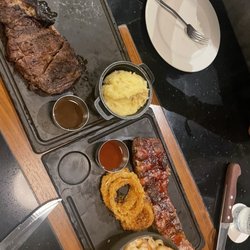 Hunter Steakhouse - Ribeye steak with mashed potatoes and side of chimchuri. Both good. Pork ribs, onion rings ok, fettucini good