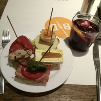 Bilbao Berria - roasted red pepper w/tuna; apple, goat cheese and quince paste, brie & quince paste; ham, tomato and padron pepper.  YUM! - Spanish Near Me - Barcelona, B