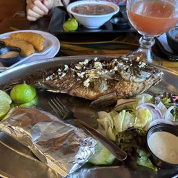 Mojarra frita -Tilapia w/ ajo, camaron empanadas, michelada Mojarra frita -Tilapia w/ ajo, camaron empanadas, michelada