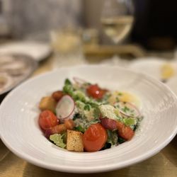 Henri - Brasserie Francaise - Caesar salad with a poached egg. The egg was unfortunately translucent and just needed more time. It watered down an otherwise great salad.