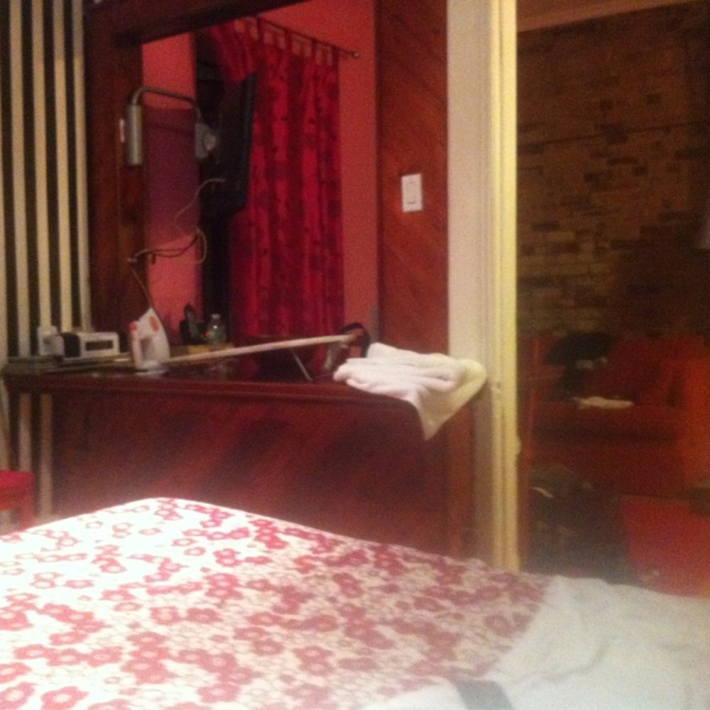 University Bed & Breakfast - Looking from the bedroom into the living room - Red Room - Hotels Near Me - Montreal, Quebec University Bed & Breakfast - Looking from the bedroom into the living room - Red Room - Hotels Near Me - Montreal, Quebec