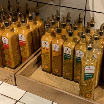 Nando's - The myriad of Peri Peri sauces - Chicken Shop Near Me - Soho, XGL