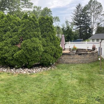Dragonfly Farms - A view of the rock wall with planters from the garden center - Nurseries & Gardening Near Me - Hamilton, New Jersey