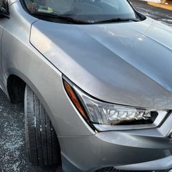 Lightning autobody - After: hood repaired and painted as well as bumper.